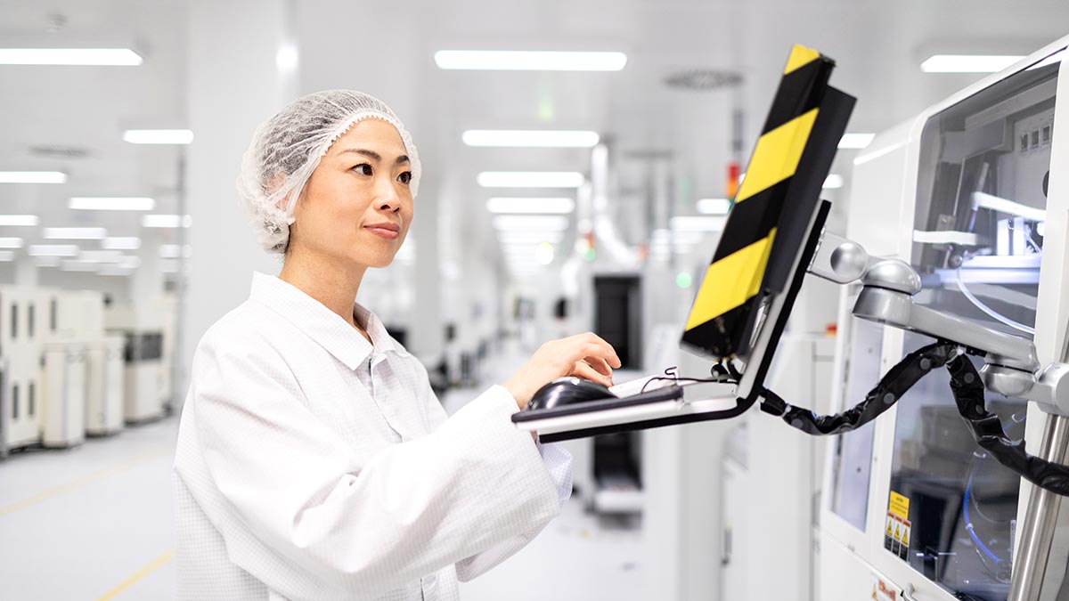 Technician Operating SMT (Surface Mount Technology) Machine in eWEAT HiFi/Digital Music Player Manufacturing Facility - eweat.com